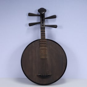 A Rare Wooden Qin Ornament