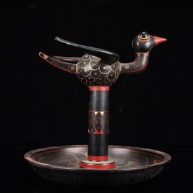 An Exquisite Black Lacquer Painted Gold Bird Ornament