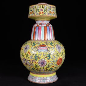 An Exquisite Yellow Ground Famille-Rose Lotus and Eight Treasures Pattern Vase