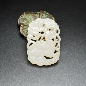 An Exquisite White Jade Sheep Pattern Pendant