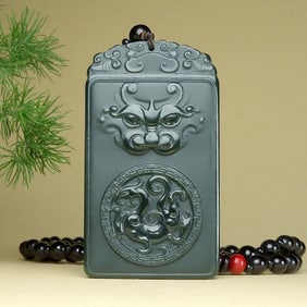 An Exquisite Greenish Jade Beast-Face Pattern Pendant