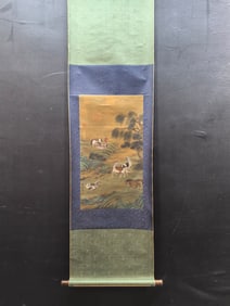 A vertical scroll of Chinese ink painting of saddle horse figures on silk