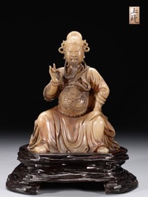A Rare Hibiscus Stone Carved Guan Yu Statue