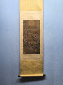 A vertical scroll of Chinese ink flower and bird painting on silk