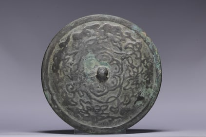 A Rare Bronze Interlocking Lotus Pattern Mirror