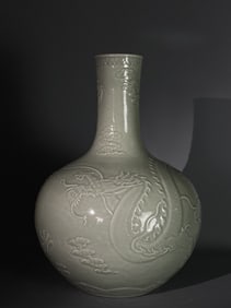 A Rare Celadon Glazed Carved Seawater Dragon Pattern Vase