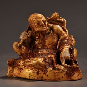 A Rare Carved White Jade Arhat Statue
