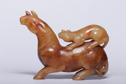 A Rare Yellow Jade Auspicious Beast