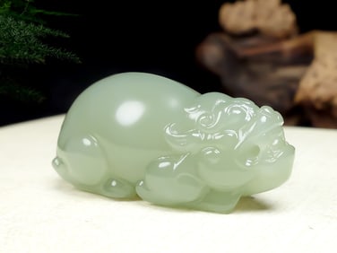 An Exquisite White Jade Auspicious Beast Pendant