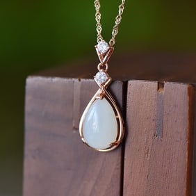 An Exquisite Sterling Silver-Gold Plated Inlaid White Jade Pendant