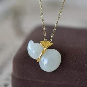 An Exquisite Sterling Silver-Gold Plated Inlaid White Jade Pendant