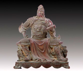 A solemn bronze statue of Guan Gong