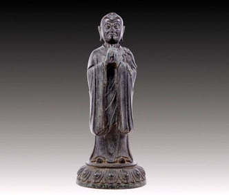 A solemn bronze Arhat statue