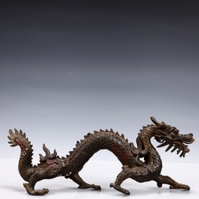A Solemn Gilt Bronze Dragon Ornament