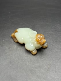 An Exquisite White Jade Auspicious Beast Hand Piece