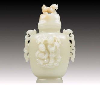An Exquisite White Jade 'Boy' Phoenix-Handled Vase And Cover