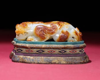 An Exquisite White Jade Auspicious Beast Hand Piece