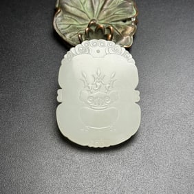 An Exquisite White Jade Weaponry Pattern Pendant
