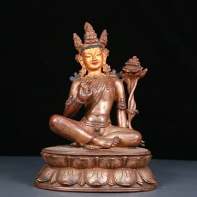 An exquisite gilt bronze and silver statue of Tara