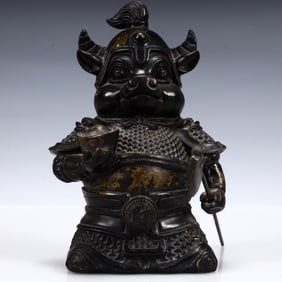 A Solemn Gilt Bronze Buffalo Ornament