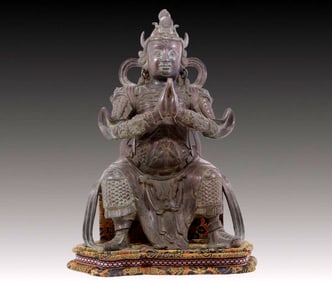 A solemn bronze Veda statue