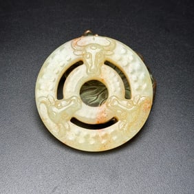 An Exquisite White Jade Buffalo-head Pattern Pendant