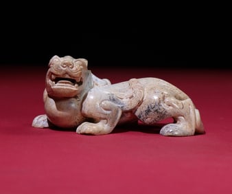 An Exquisite Gaogu Jade Auspicious Beast Hand Piece