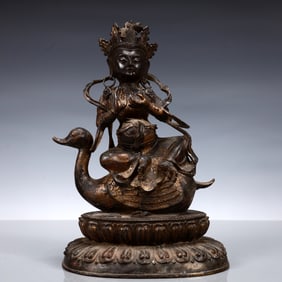 A Solemn Gilt Bronze Statue of Gautama’s Mother