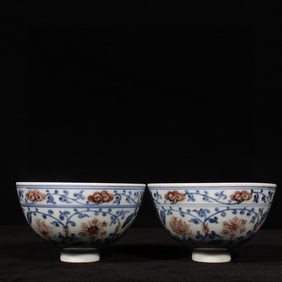 A Pair of Exquisite Blue and White Underglaze-Red Lotus Pattern Cups