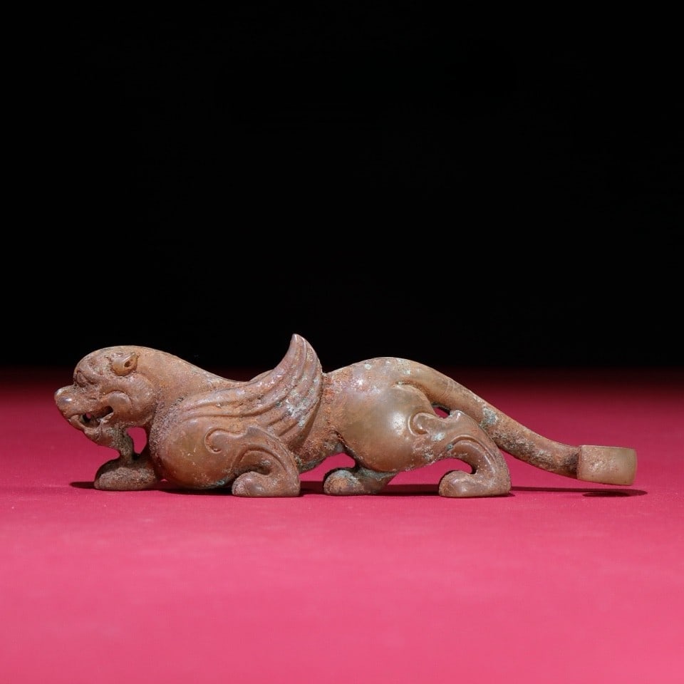 An Exquisite White Jade Auspicious Beast Hook (1 of 9)