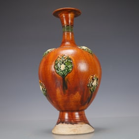 A Exquisite Trio-colored glazed pottery of the Tang Dynasty Flower Pattern Vase