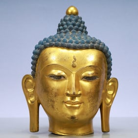 An Exquisite Gilt Bronze Buddha head