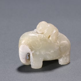 A Rare Hetian Jade Child Playing with Elephant Ornament