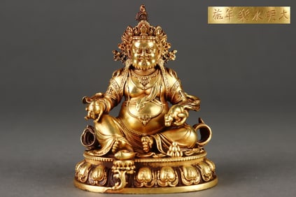 A Rare Gilded Purple Copper Body Yellow Jambhala Seated Statue