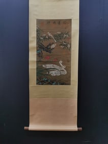 A vertical scroll of Chinese ink flower and bird painting on silk