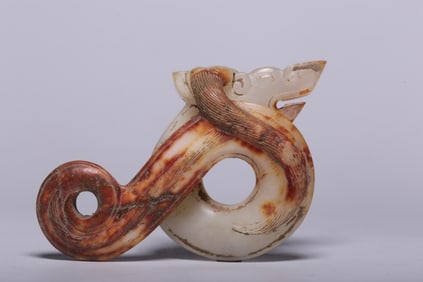A Rare Archaic Jade Coiled Dragon