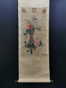 A vertical scroll of Chinese ink flower and bird painting on silk