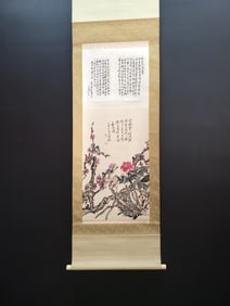 A vertical scroll of Chinese ink flower painting on paper