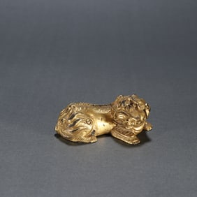 A Rare Gilt Bronze Auspicious Beast Paper Weight