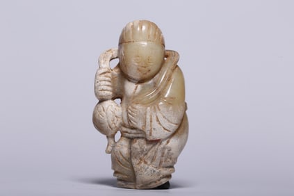 A Rare Archaic Jade Boy Playing with Ball