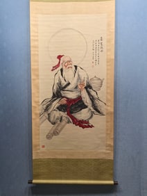 A vertical scroll of Chinese ink figure painting on paper