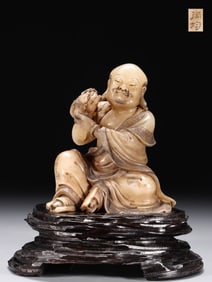 A Rare Hibiscus Stone Carved Lion Playing Arhat Seated Statue