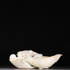 A Rare White Jade Mandarin Duck Holding Peach Branch Ornament