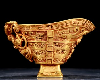 An exquisite gilt bronze cup with dragon pattern