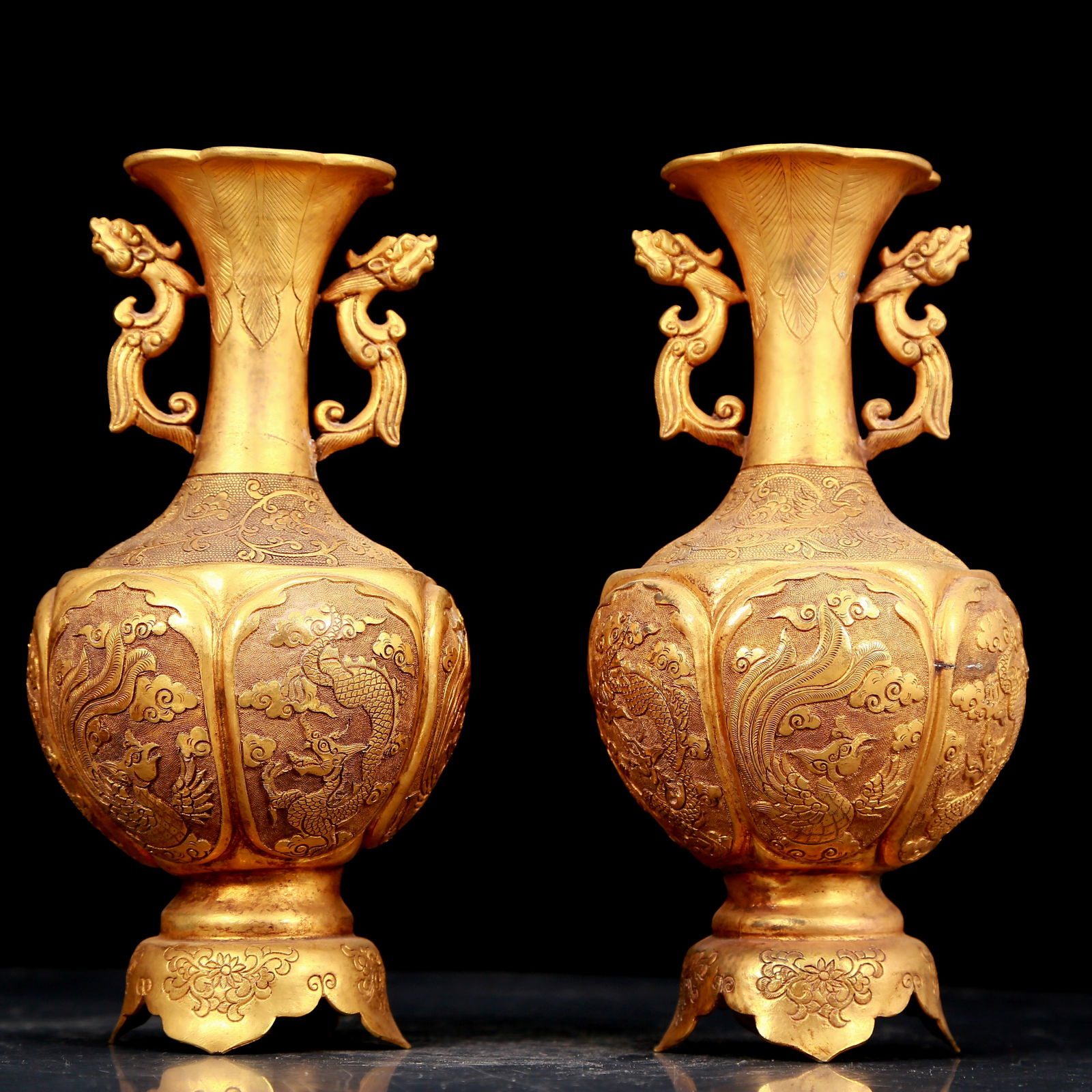 pair of exquisite gilt bronze amphora with dragon and phoenix patterns: A pair of exquisite gilt bronze amphorae with dragon and phoenix patterns, Qing Dynasty, China. The surface has been carefully carved, vividly demonstrating the superb skills of the craftsmen. It has