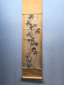 A vertical scroll of Chinese ink flower and bird painting on paper