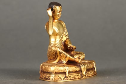 A Rare Gilded Purple Copper Body Milarepa Seated Statue