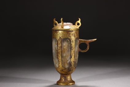 A Rare Gilt Bronze Jade-Inlaid Ring-Handled Covered Cup