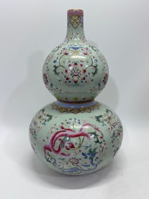 A Rare Famille-Rose Green Ground Lotus and Dragon Pattern Gourd-Shaped Vase