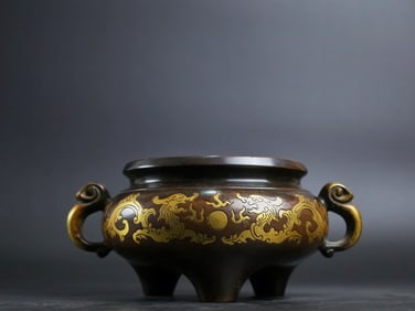 A Rare Red Copper Pattern-Carved and Gilt Ruyi-Ears Censer